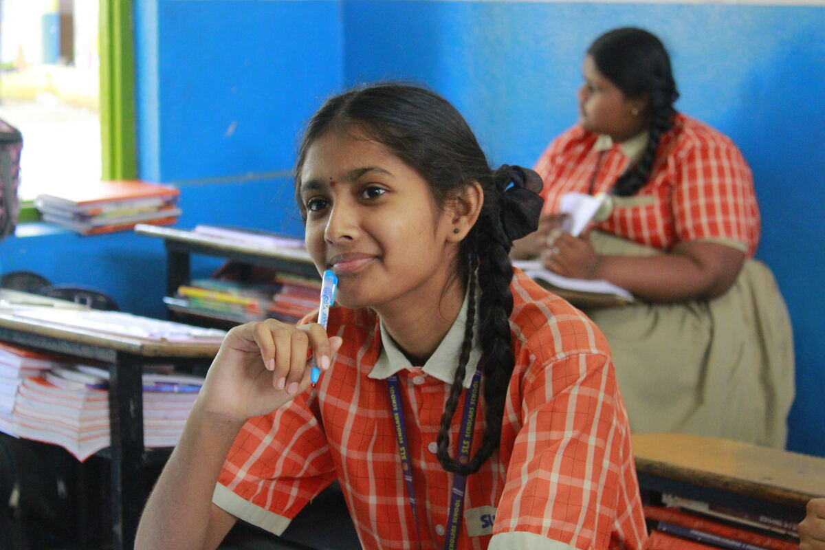 SLS student smiling in class
