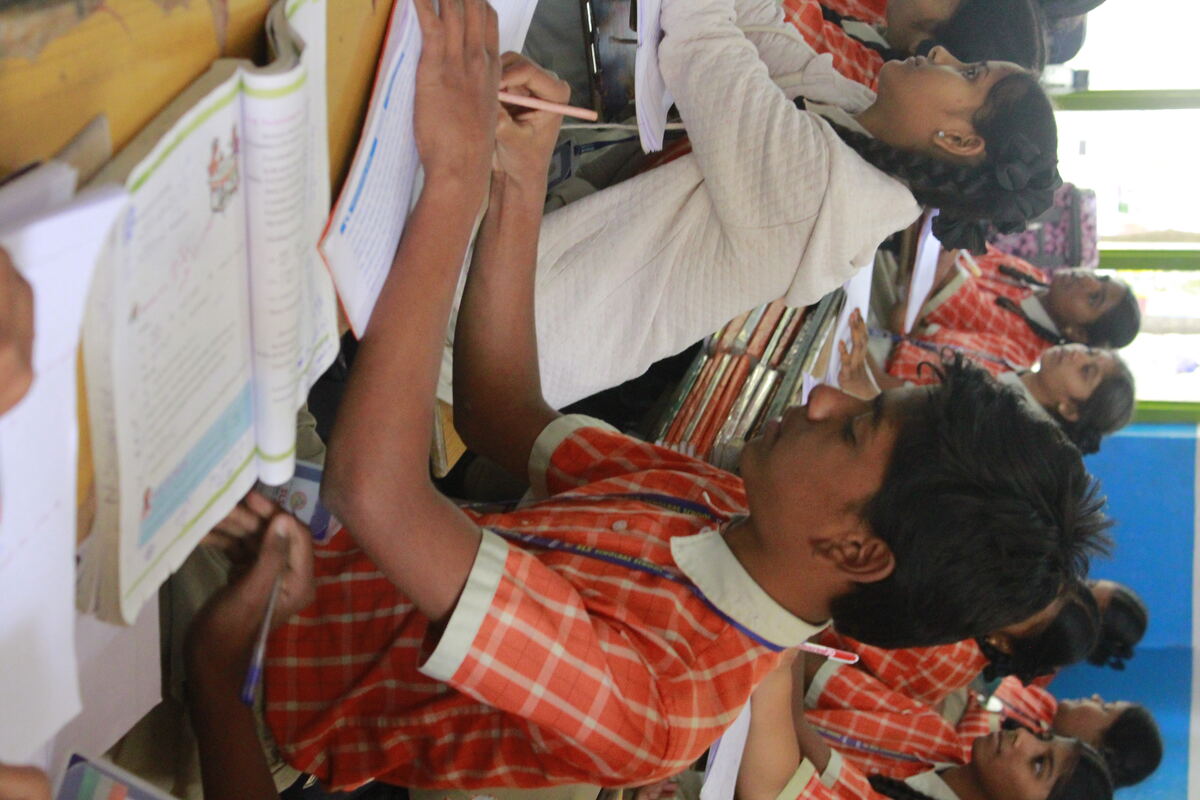 SLS students writing in their notebooks